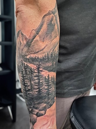 Tattoo of grayscale landscape