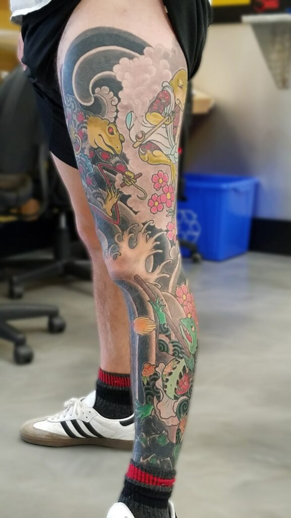 Leg sleeve with frog deities with waves and wind