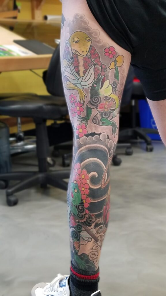 Leg sleeve with frog deities with waves and wind