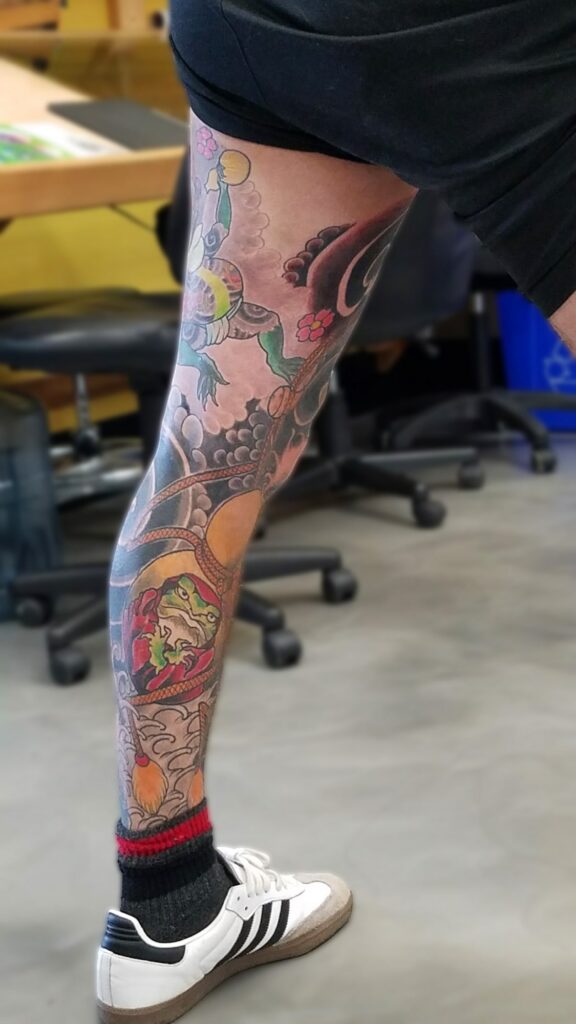Leg sleeve with frog deities with waves and wind