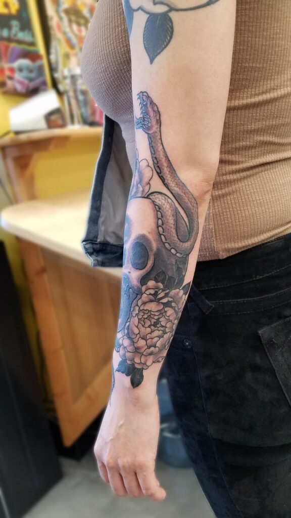 Black and gray half sleeve with snake and skull