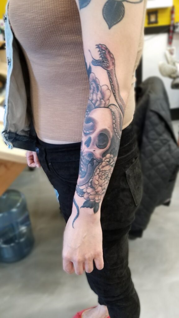 Black and gray half sleeve with snake and skull